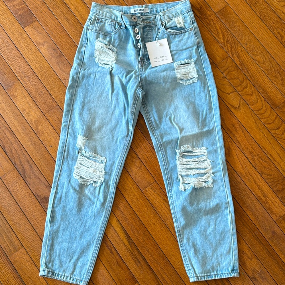 Light blue ripped MOM jeans.